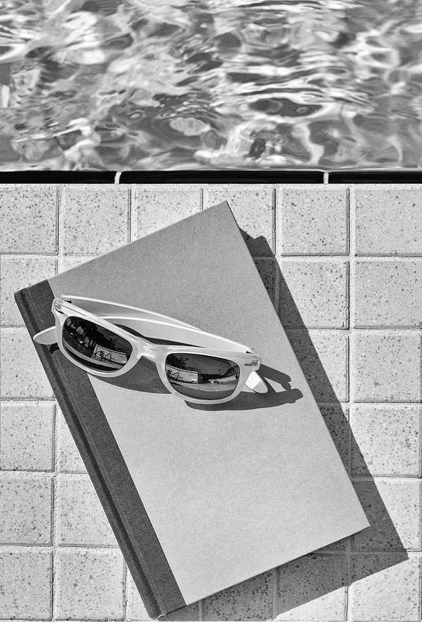 Poolside Reading black and white Photograph by Laura Fasulo