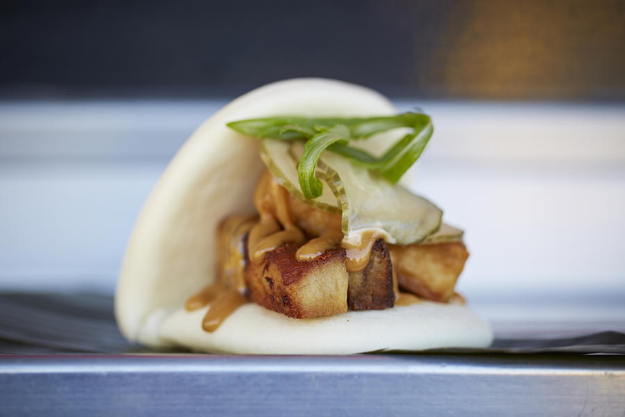 Pork belly on a Chinese steamed bun Photograph by Tracey Kusiewicz/Foodie Photography