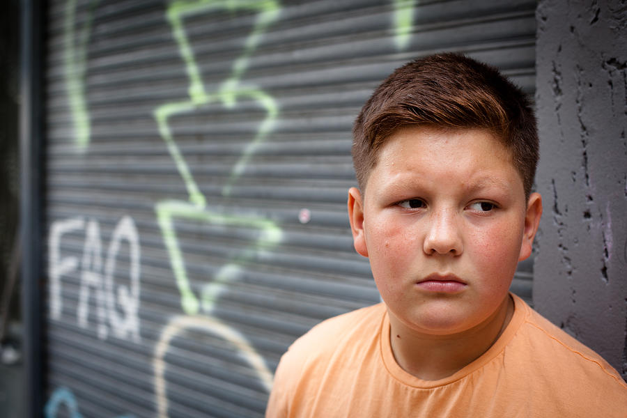 Portrait From A Pensive Overweight Teenage Boy Photograph by Fotografixx