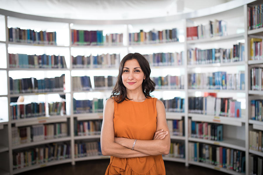 Portrait of a beautiful librarian Photograph by Miodrag Ignjatovic