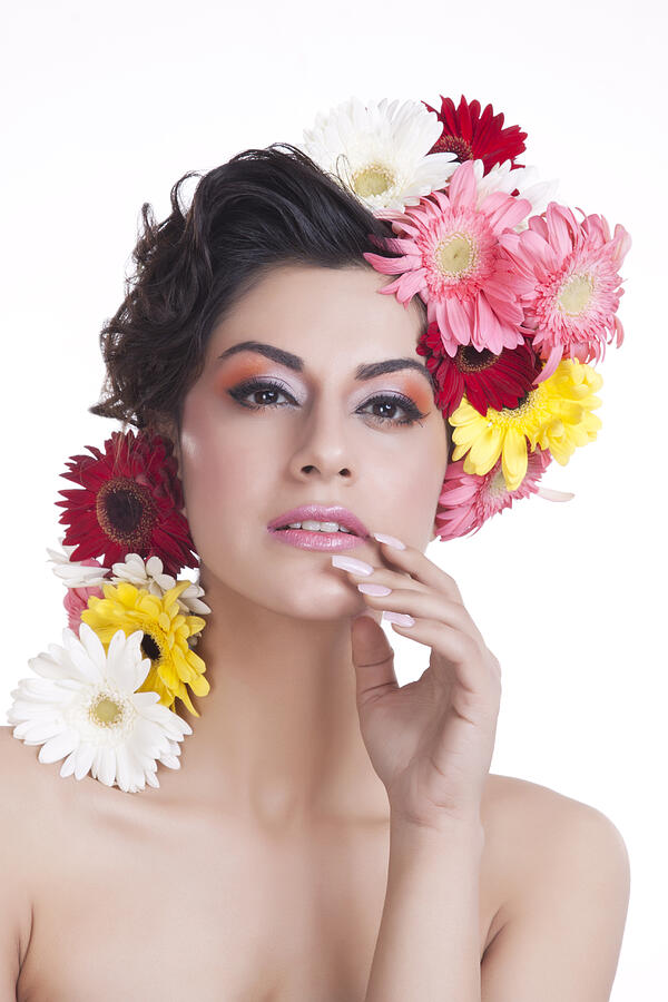 Portrait of a beautiful woman with flowers in hair Photograph by IndiaPix/IndiaPicture