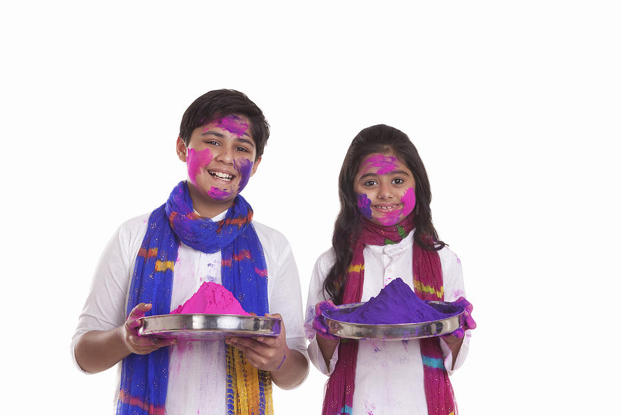 Portrait of a boy and girl with holi colour Photograph by IndiaPix/IndiaPicture