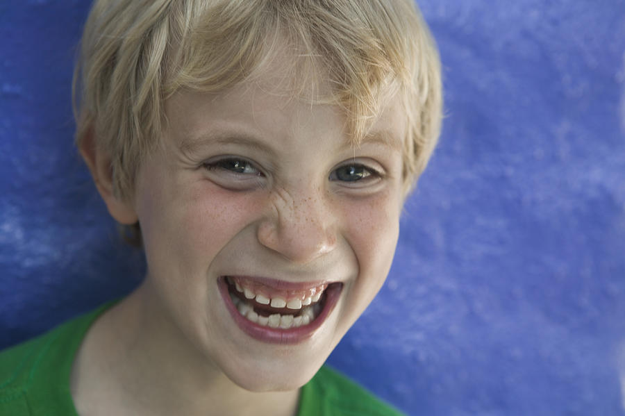 Portrait of a boy laughing Photograph by Photodisc