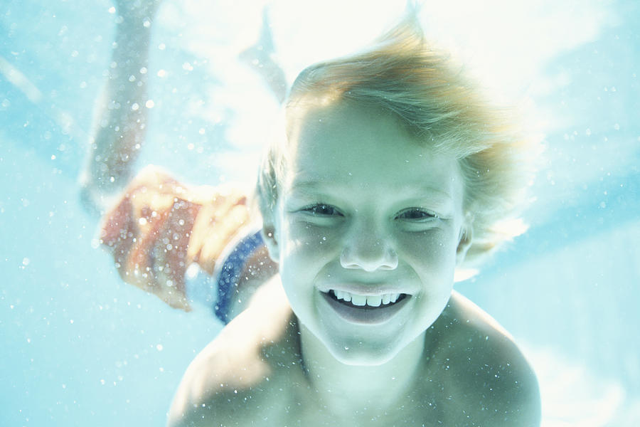 Portrait of a Boy Swimming Underwater Photograph by B2M Productions