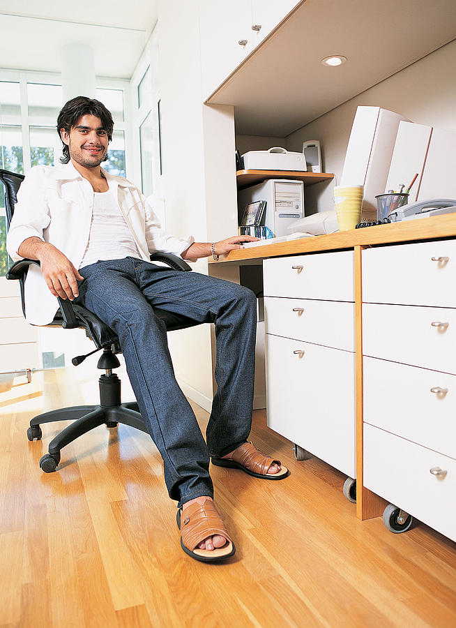 Portrait of a Businessman Sitting in a Home Office Photograph by Javier Pierini