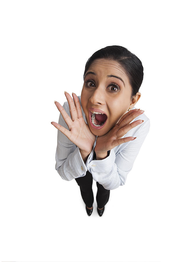 Portrait of a businesswoman screaming Photograph by Uniquely India