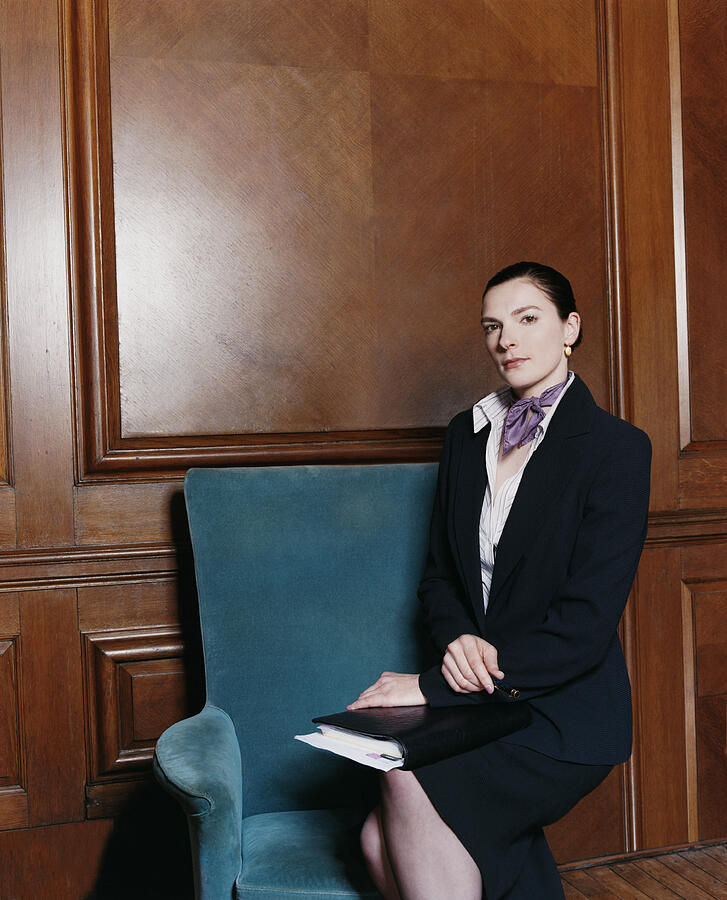 Portrait of a Businesswoman Sitting on an Armchair With a Folder on Her Lap Photograph by A J James