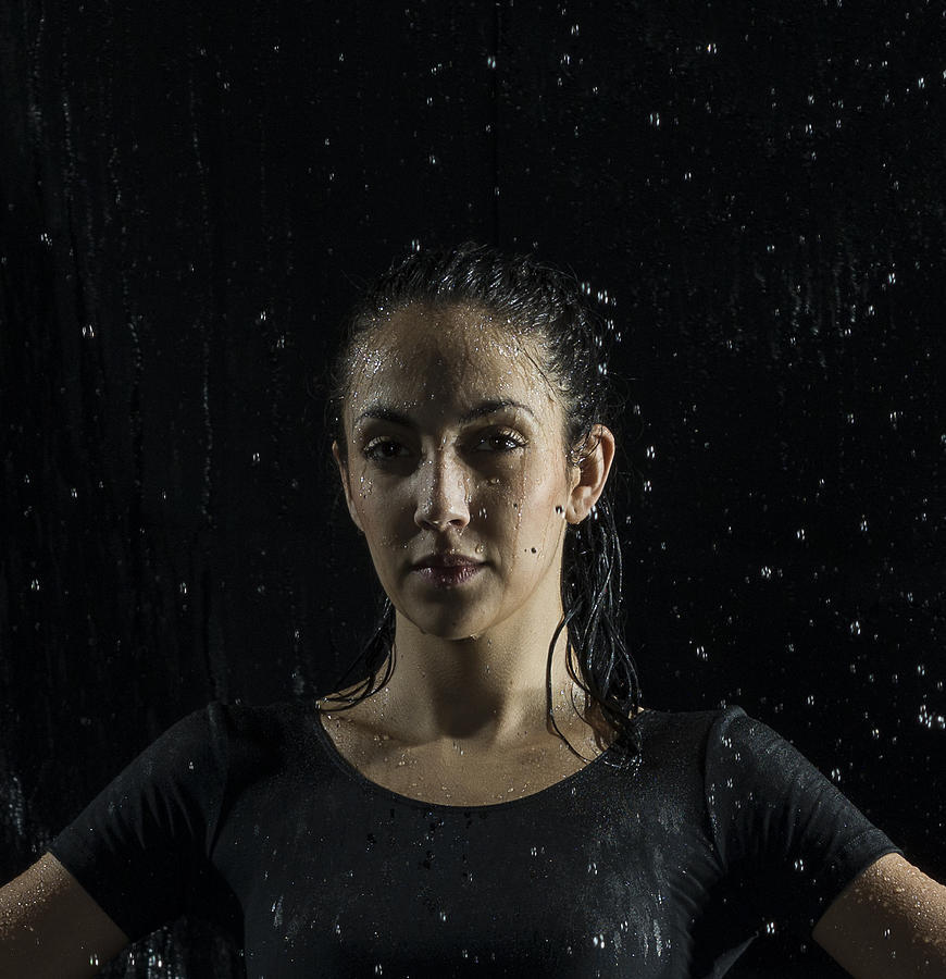 Portrait of a female athlete in rain Photograph by Jonathan Knowles