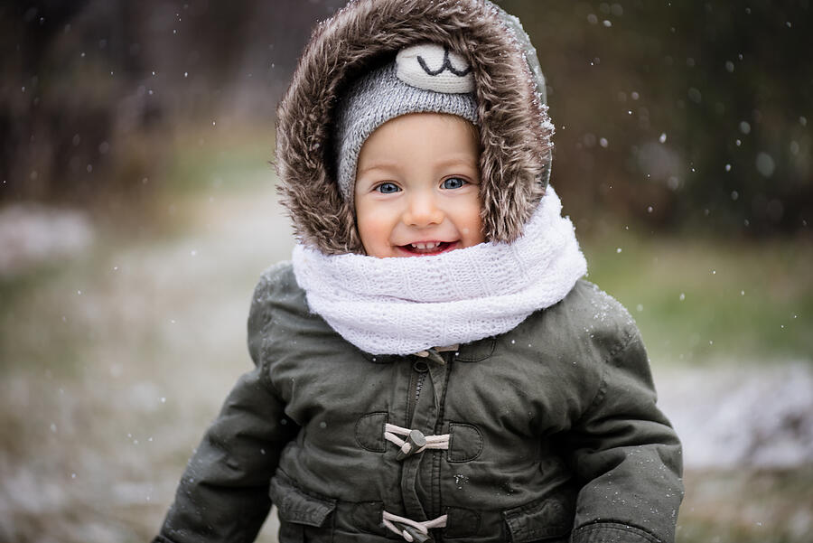 Portrait of a girl child playing in snow Photograph by Martin Novak