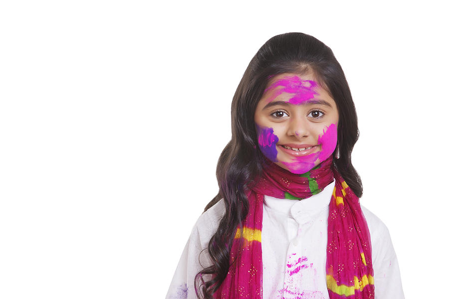 Portrait of a girl with holi colour Photograph by IndiaPix/IndiaPicture
