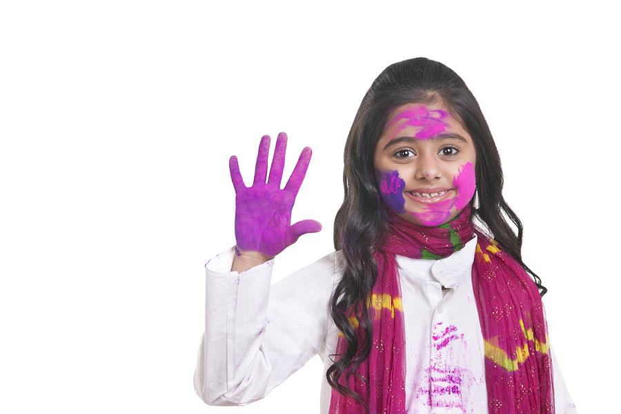Portrait of a girl with holi colour on her hand Photograph by IndiaPix/IndiaPicture