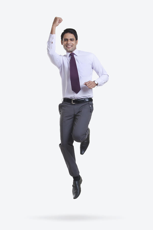 Portrait of a male executive jumping in the air Photograph by Sudipta Halder
