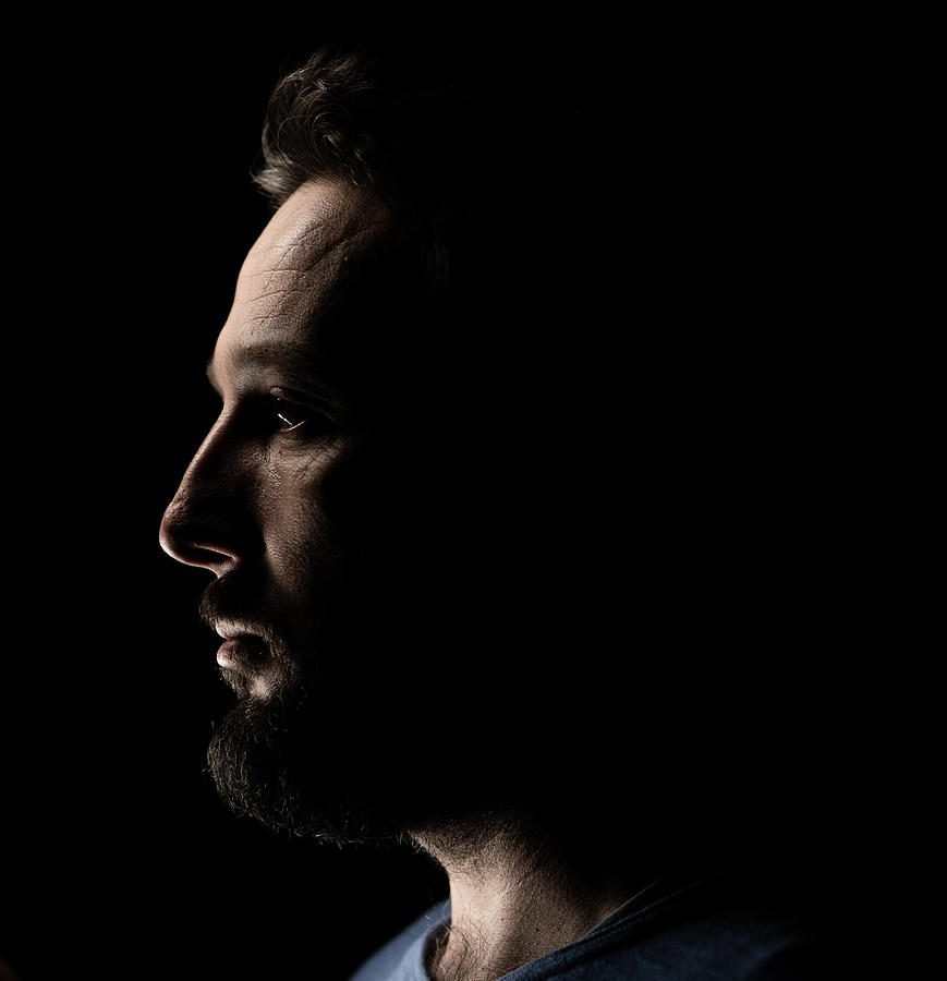 Portrait of a man in dark background Photograph by Jasmin Merdan