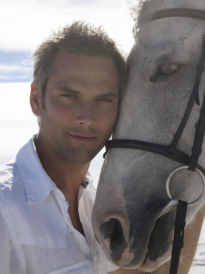 Portrait of a Man With His Horse Photograph by Digital Vision.