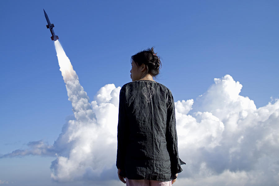Portrait of a woman against rocket launch Photograph by Maciej Toporowicz, NYC