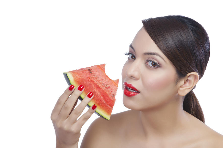 Portrait of a woman eating a watermelon Photograph by Sudipta Halder