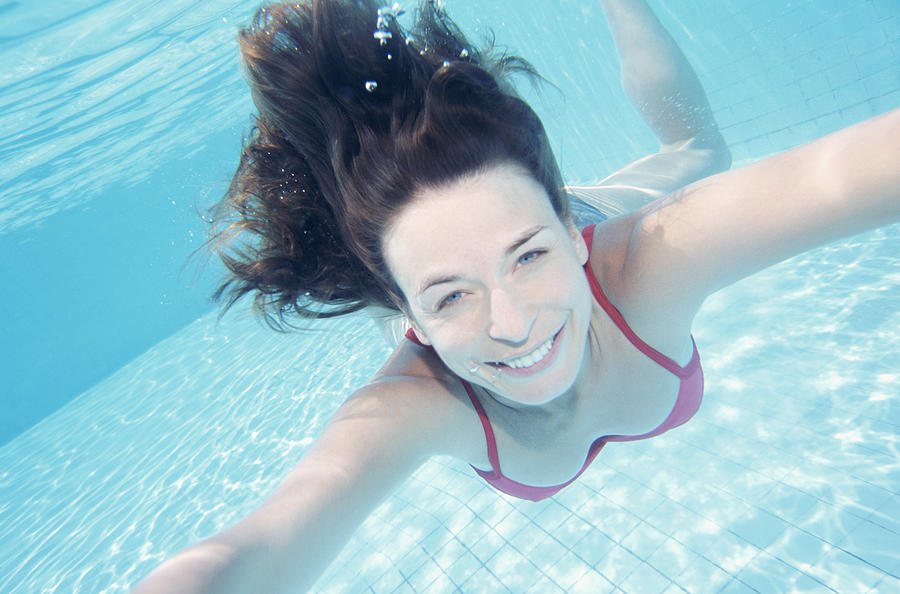 Portrait of a Woman Swimming Underwater Photograph by B2M Productions