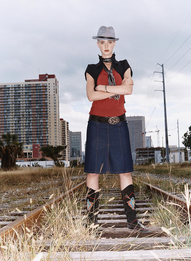 Portrait of a Woman With Attitude in Individual Clothing Standing on an Abandoned Rail Track Photograph by Digital Vision.
