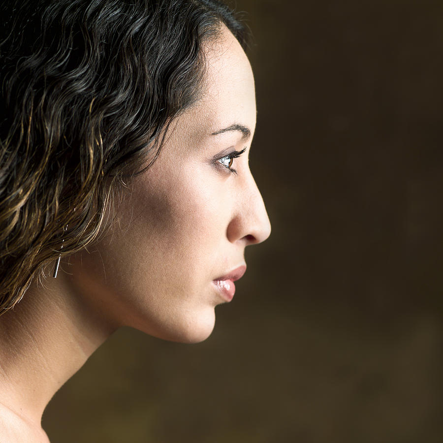 Portrait Of A Young Attractive Ethnic Looking Woman Shot In Profile Photograph by Photodisc
