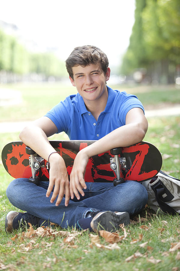 Portrait of a young man with his skateboard Photograph by Vincent Besnault