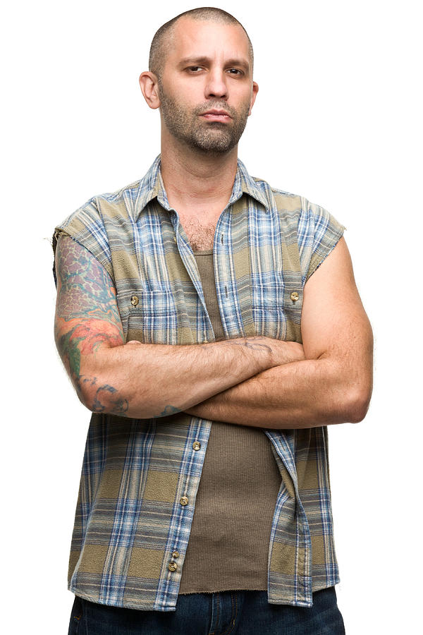 Portrait of a young man with tattoos in a checkered shirt Photograph by Drbimages