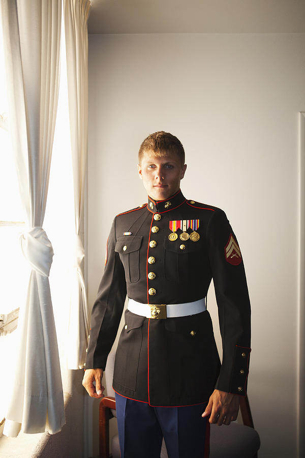 Portrait of a young Marine by the window Photograph by Camille Tokerud
