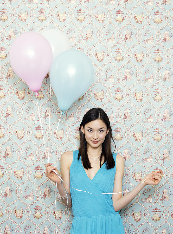 Portrait of a Young Woman in an Evening Gown Holding Balloons Photograph by Liz Gregg