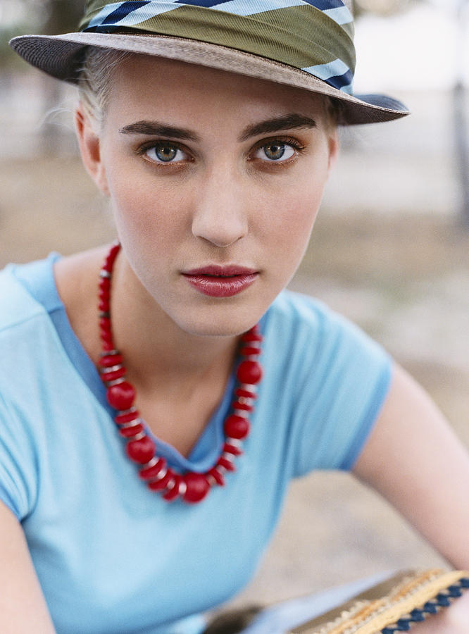 Portrait of a Young Woman Wearing a Hat Photograph by Digital Vision.