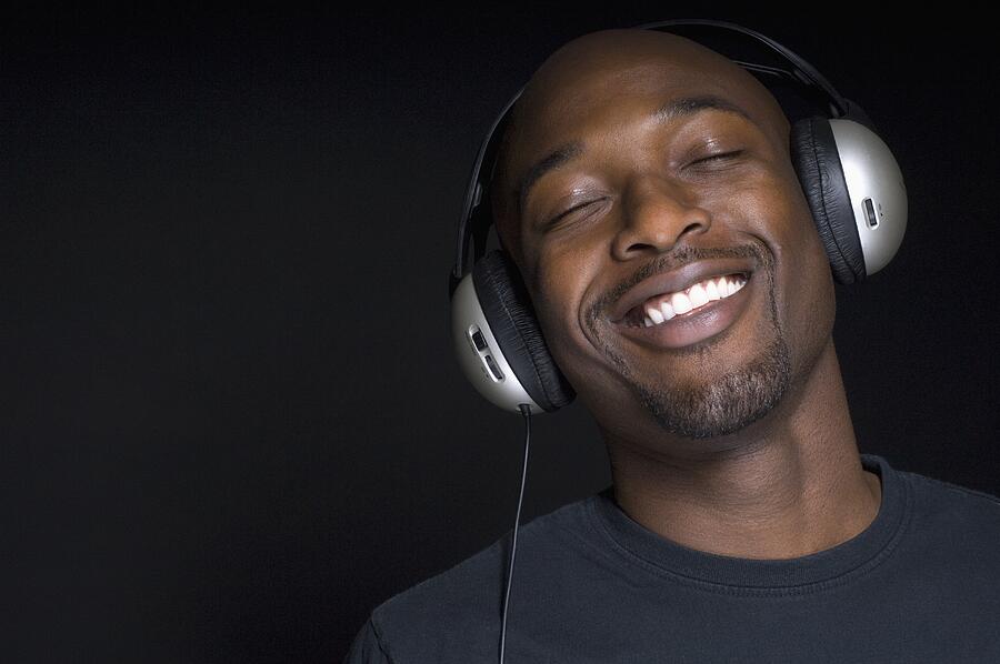 Portrait of African man wearing headphones Photograph by Todd Wright