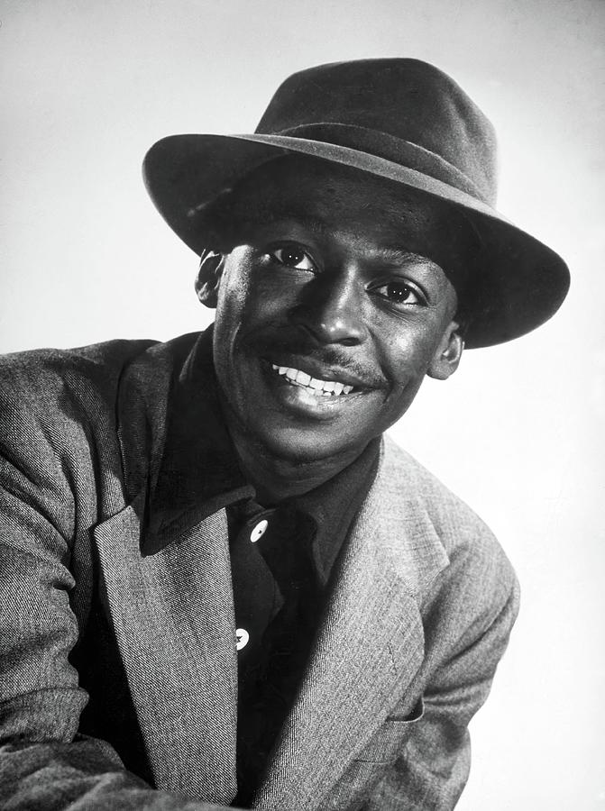 Portrait of American jazz trumpeter and banleader Miles Davis. 1947. Photograph by Album