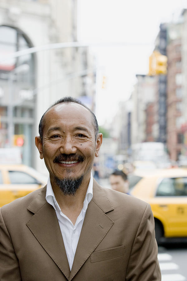 Portrait of asian mature man in downtown city Photograph by FangXiaNuo