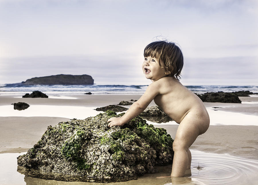 Portrait of baby on beach Photograph by Marcos Welsh
