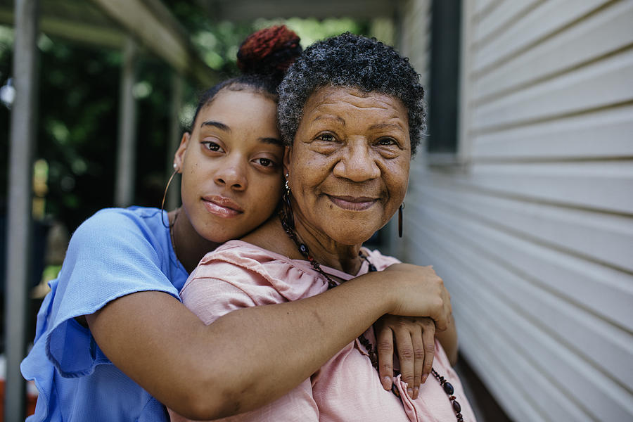 Portrait of black grandmother with teenager granddaughter Photograph by Willie B. Thomas