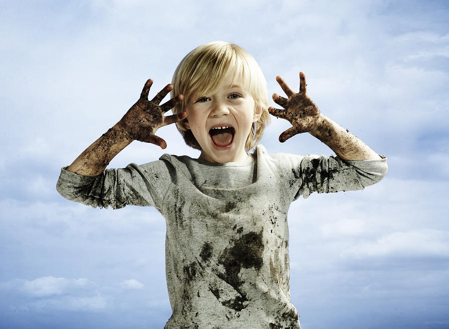 Portrait of boy covered in mud Photograph by Flashpop