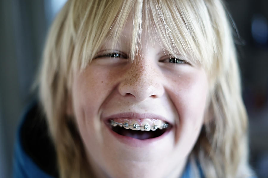 Portrait of boy laughing Photograph by Maarten van de Voort Images & Photographs
