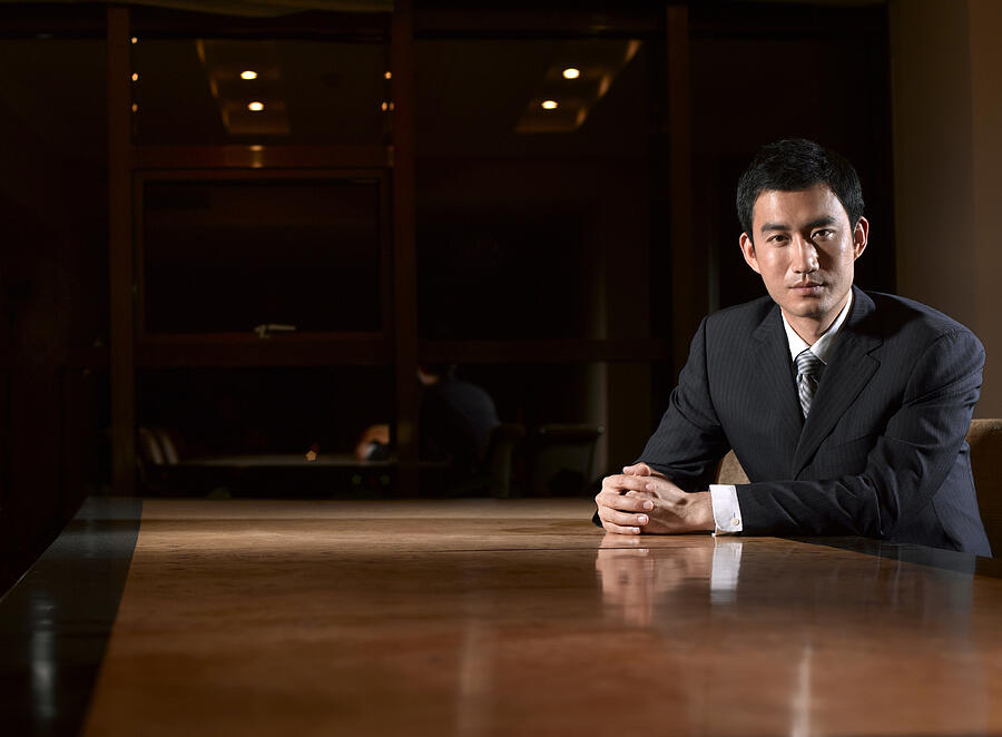 Portrait of businessman at table. Photograph by K-King Photography Media Co. Ltd