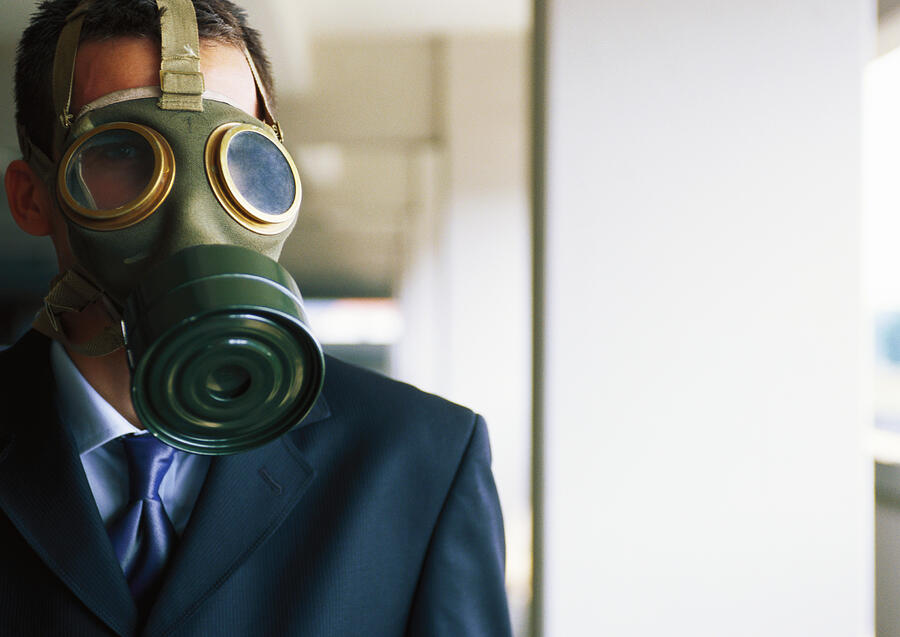 Portrait of businessman with gas mask covering  face Photograph by Sanna Lindberg