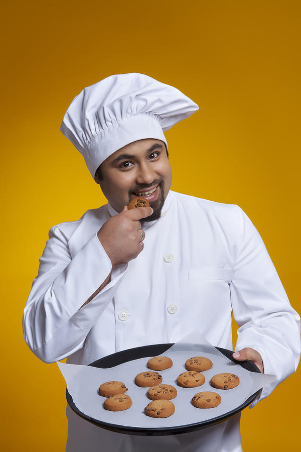 Portrait of chef eating a cookie Photograph by Ravi Ranjan