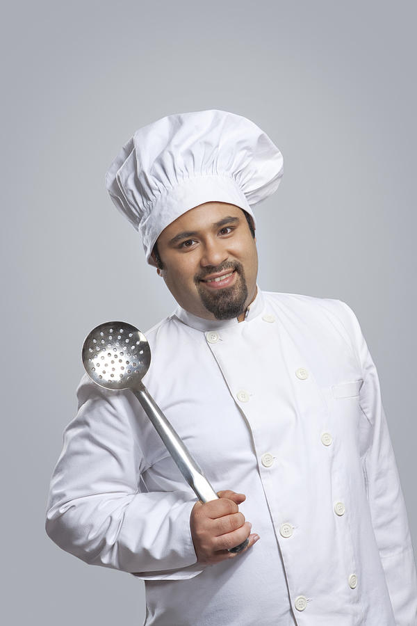 Portrait of chef holding a skimmer Photograph by Ravi Ranjan
