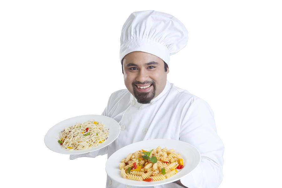 Portrait of chef holding plates with pasta Photograph by Ravi Ranjan