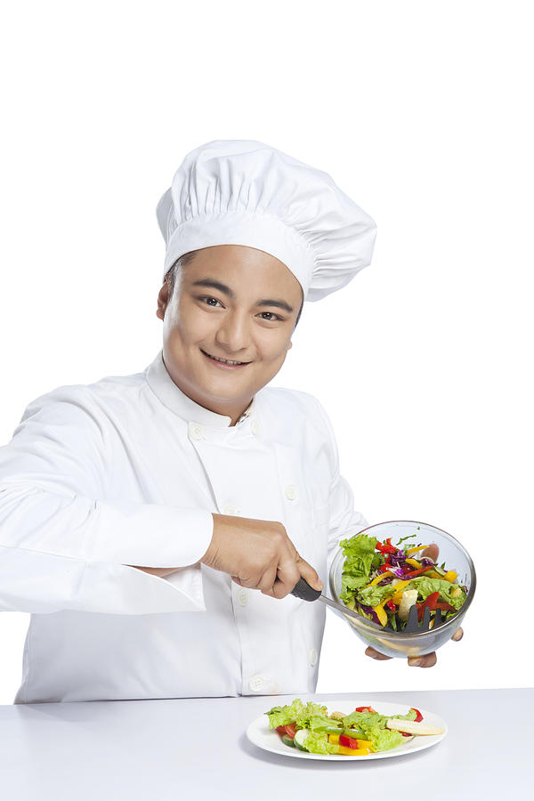 Portrait of chef serving vegetables on plate Photograph by Ravi Ranjan