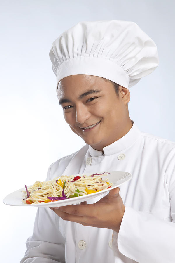 Portrait of chef with plate of noodles Photograph by Ravi Ranjan