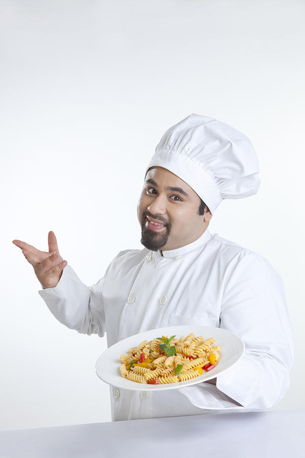 Portrait of chef with plate of pasta Photograph by Ravi Ranjan