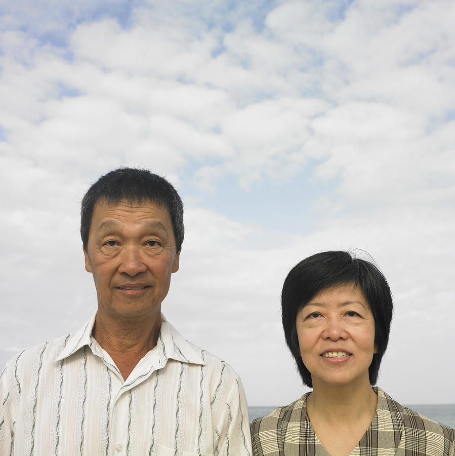 Portrait of couple standing at beach Photograph by Dave & Les Jacobs
