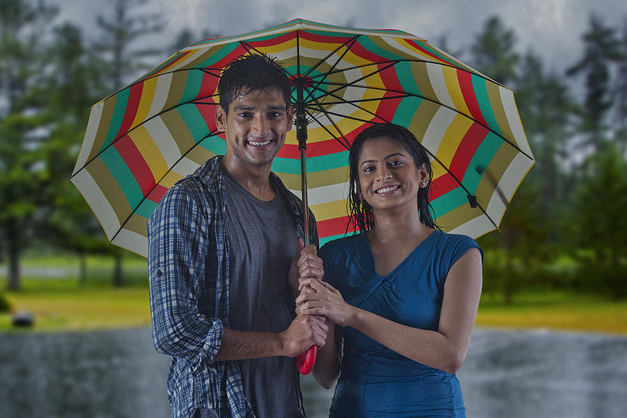 Portrait of couple with umbrella Photograph by Abhinandita Mathur 