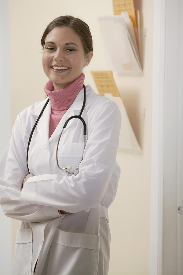 Portrait of doctor smiling Photograph by Comstock Images