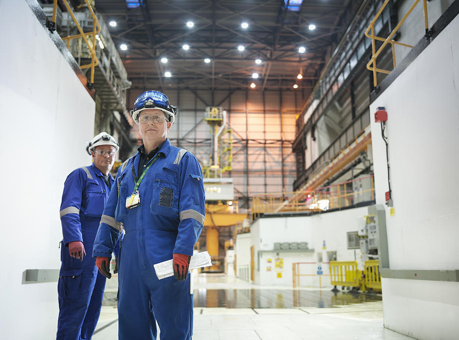 Portrait of engineers in reactor hall in nuclear power station Photograph by Monty Rakusen