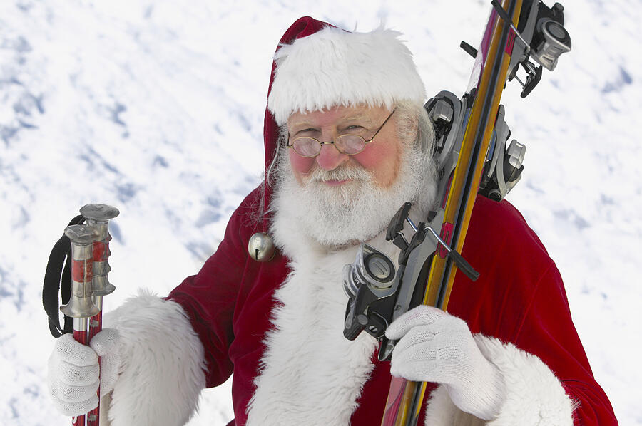 Portrait of Father Christmas With Skis Photograph by Digital Vision.