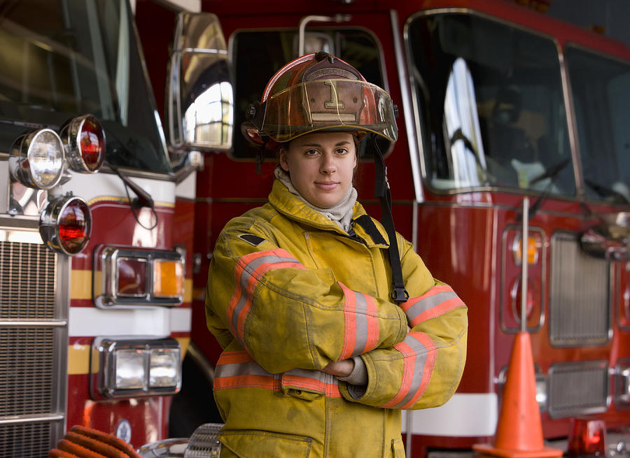Portrait of Female Fire Fighter in Fire Station Photograph by Ariel Skelley