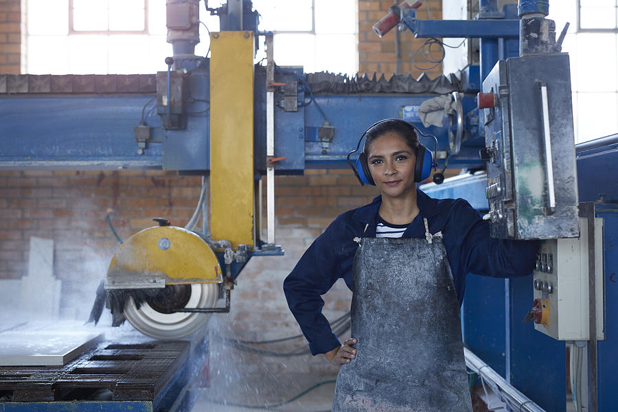 Portrait of female worker at stone factory Photograph by Klaus Vedfelt
